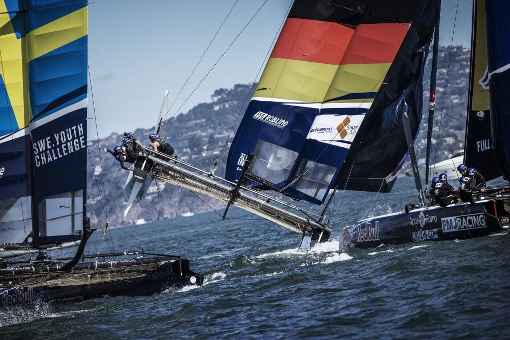 Members of Swedish Youth Challenge and All In Racing of Germany compete during the third race of the Red Bull Youth America’s Cup in San Francisco, California on September 2, 2013.